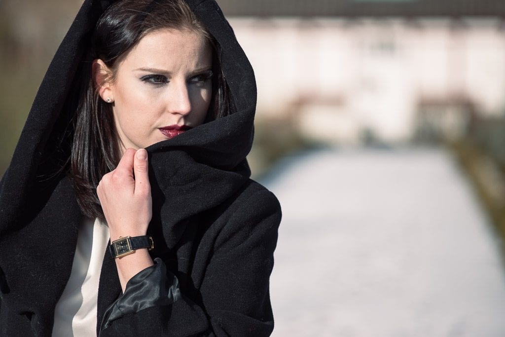 Model in black coat